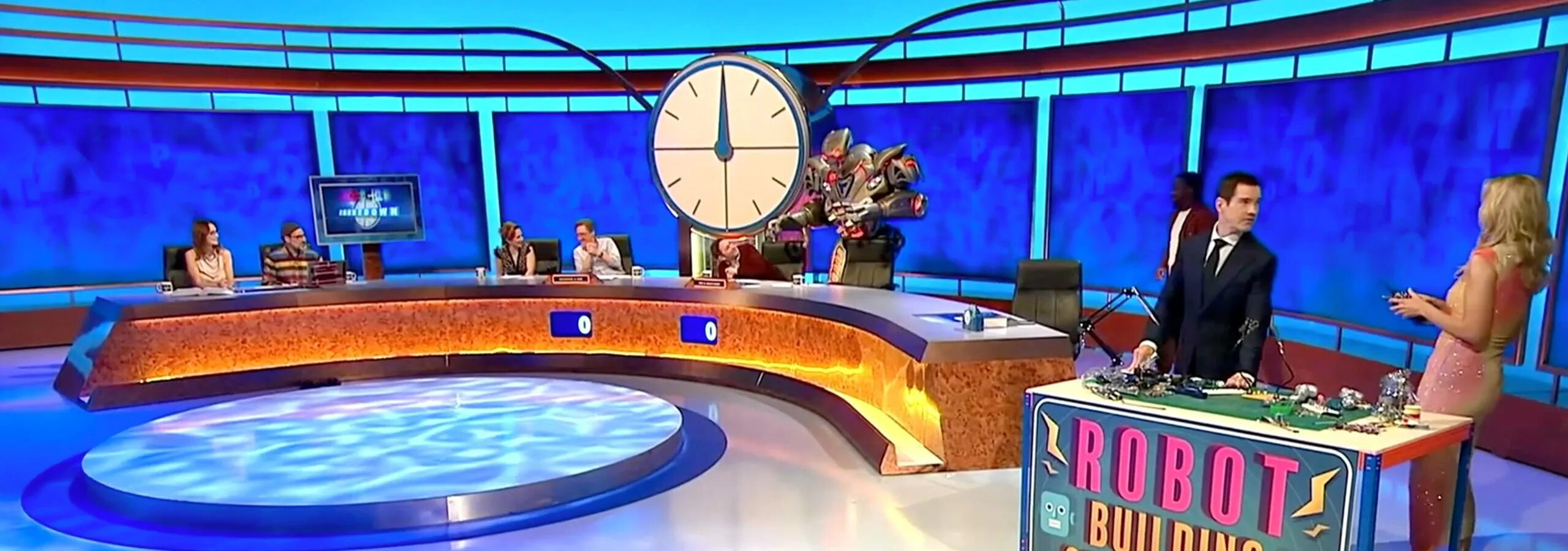 Titan the Robot performing on the television show eight out of ten cats does countdown, with Alan Carr, Rachel Riley and other comedian guest