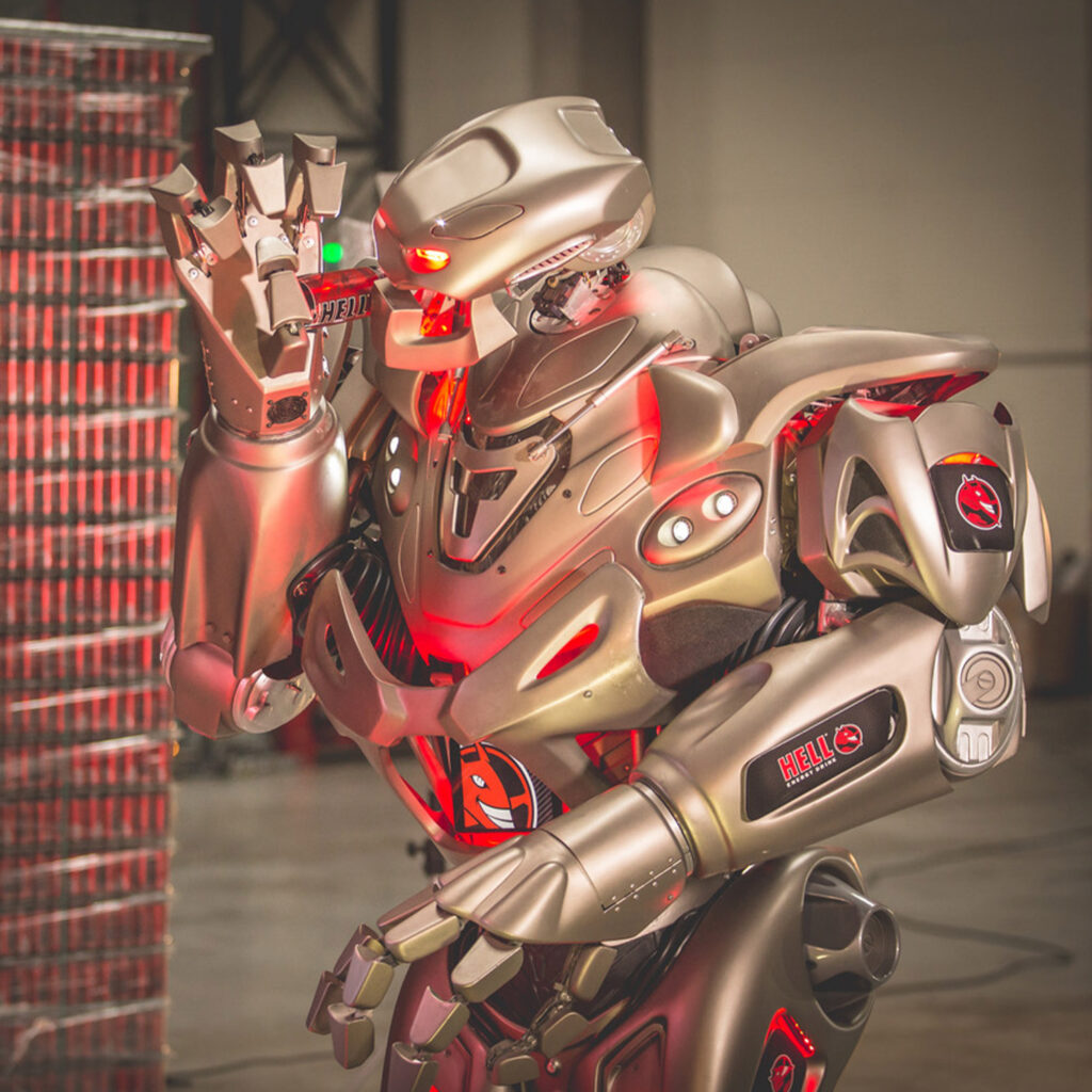 The live entrertainment act 'Titan the Robot', drinking from a can of hell energy drink, while heavily branded with the companys logos