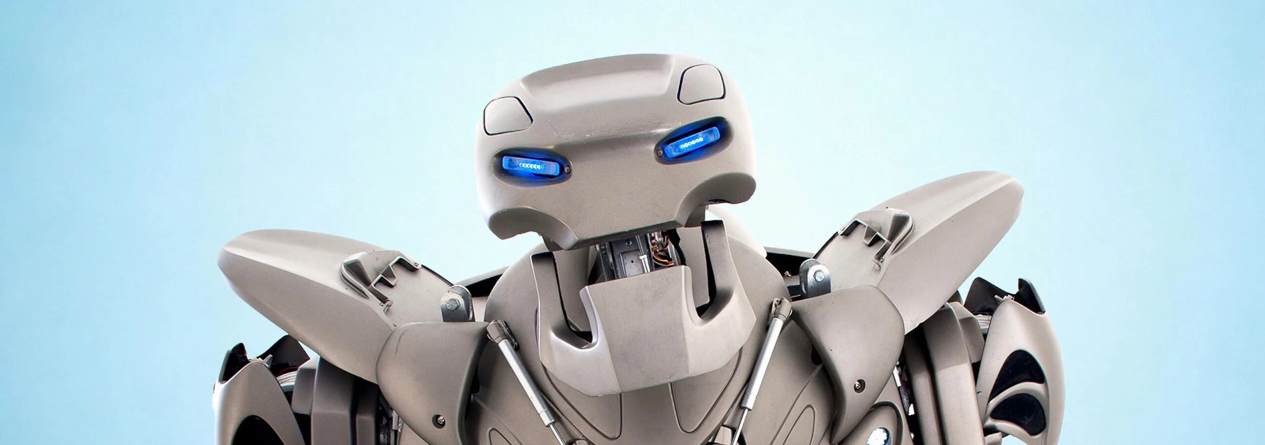 Studio Image of Titan the Robots face, looking into the camera, with a light blue background.