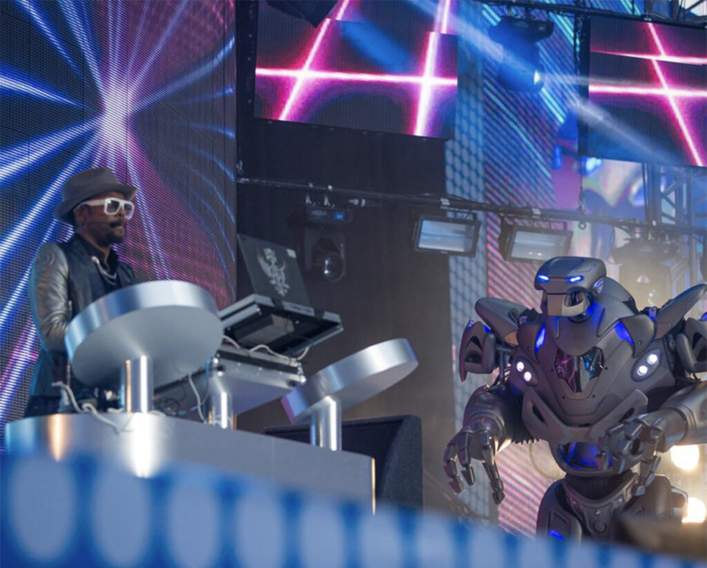 Titan the Robot stands on stage with will.i.am at the capital fm summertime ball.