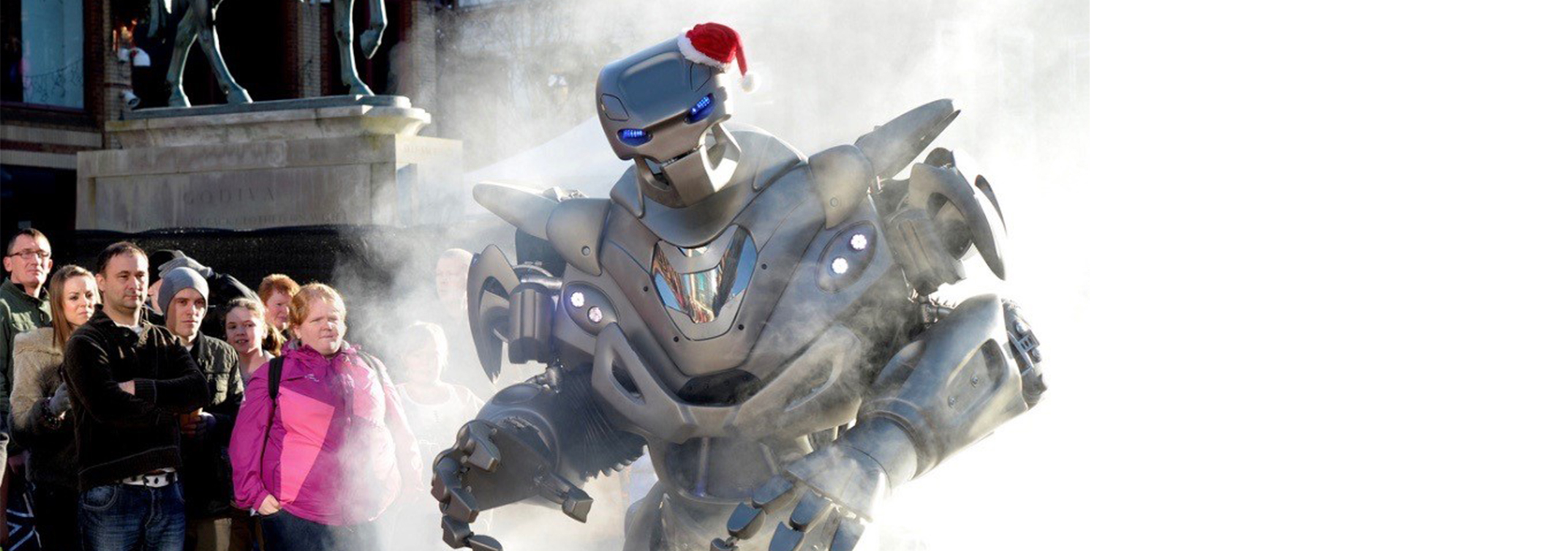 Titan the Robot moves out of a white mist at a Christmas lights switch on event